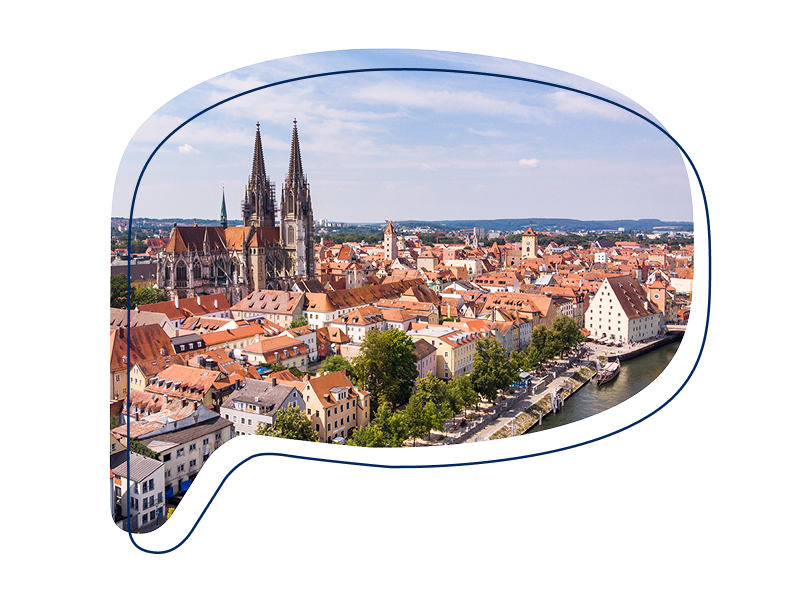 Blick von oben auf die Altstadt Regensburg in einer Sprechblase